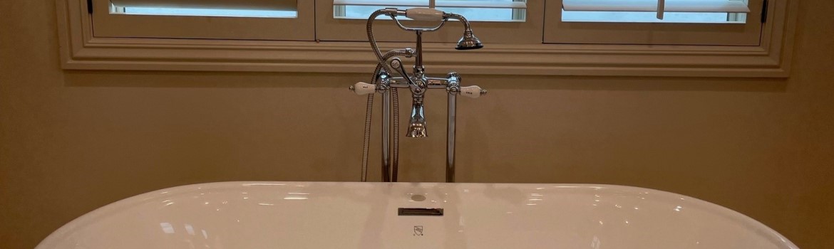 bathtub by window